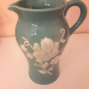 Blue ceramic pitcher with white flowers
